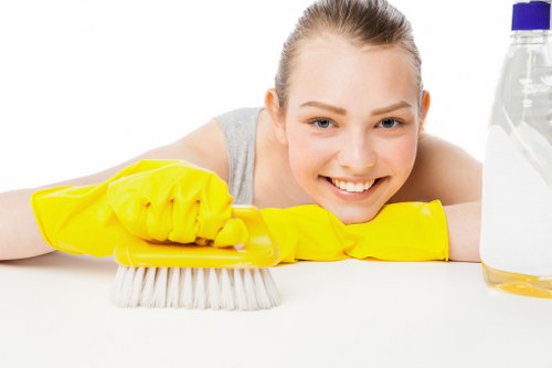 Staff member using protective gear during carpet cleaning